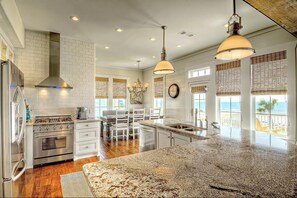 Chef's kitchen and dining with ocean front views.