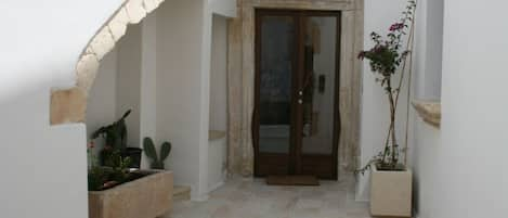 Entrance courtyard with old stone sink