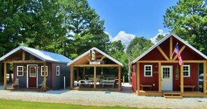 Full view of both cabins divided by outdoor kitchen. 