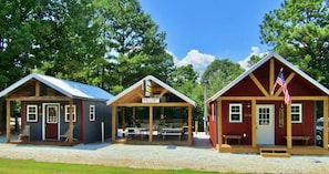 Full view of both cabins divided by outdoor kitchen. 