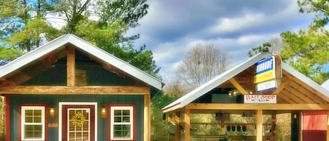 Cozy cabin/tiny home with complete outdoor kitchen and lockable boat shelters.