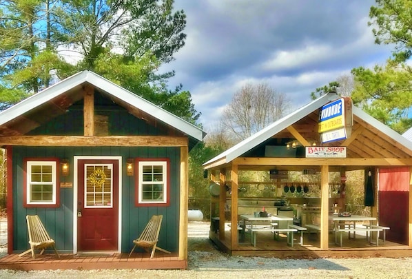 Cozy cabin/tiny home with complete outdoor kitchen and lockable boat shelters.