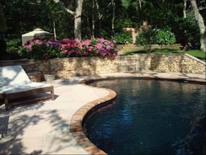 Free Form Black Bottom Heated Pool In Custom Stone Patio