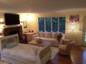 Living Room with huge Flatscreen TV & Custom Chandeliers