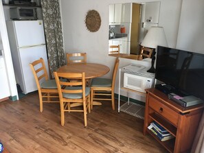 Dining and living area with upgraded vinyl plank floors