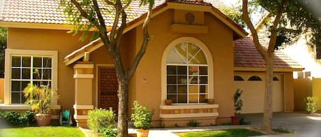 The home is surrounded by beautiful, lush, green tree's.