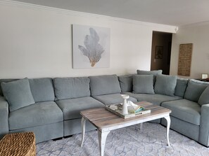 spacious updated Livingroom with new carpeting and furniture.