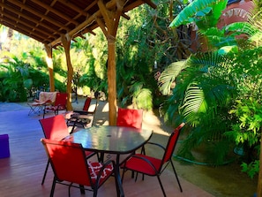 Secluded by the garden creating a beautiful dining space.