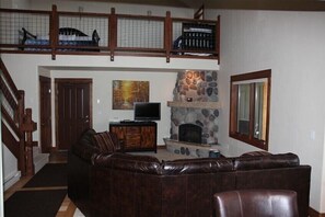 Living room showing loft area above.