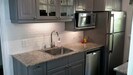 Under cabinet lighting and lovely granite counters.