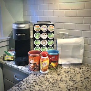 Enjoy a Keurig Coffee maker with a K-Cup supply and necessities.