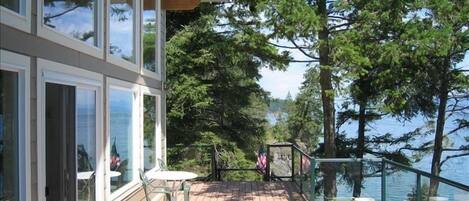 FRONT OF CABIN WITH DECK AND LAKE