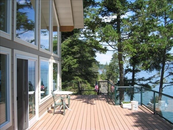 FRONT OF CABIN WITH DECK AND LAKE