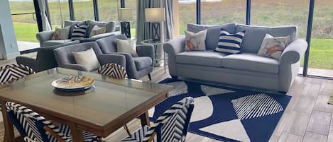 Living/Dining Area with Floor to Ceiling Windows and Ocean View