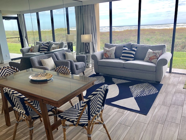 Living/Dining Area with Floor to Ceiling Windows and Ocean View