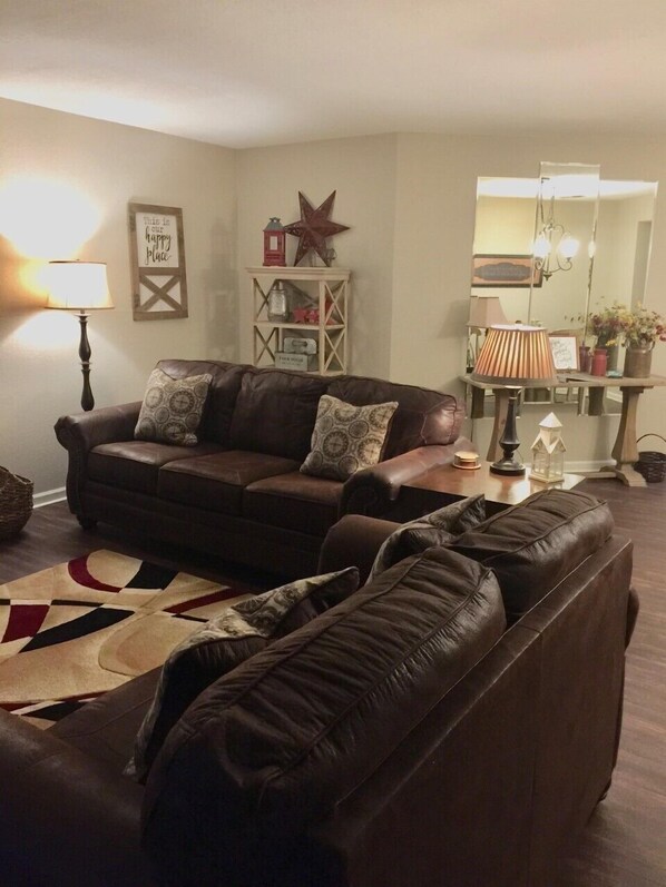 Living area with sleeper sofa, love seat, and recliner.