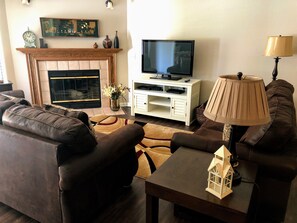 Spacious living area with a fireplace and great seating