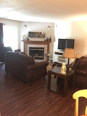 New flooring in the living area and sliding door to the patio and #1 green
