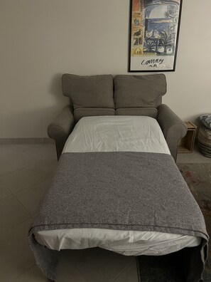 Single sleeper. Note cushions stored at head of bed to keep them off the floor.