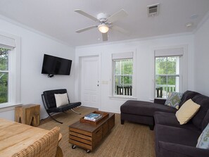 Living area offers a flat screen TV and pull out sofa