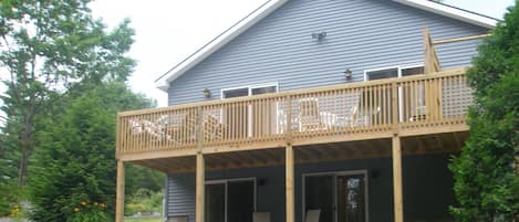 Side view of the house showing the large deck with great views of the lake