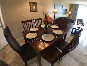 Dining area with seating for six and air conditioning.