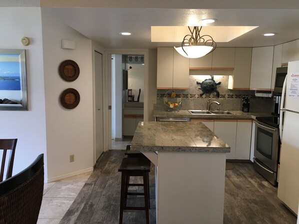 Fully stocked kitchen for preparing meals at the condo.