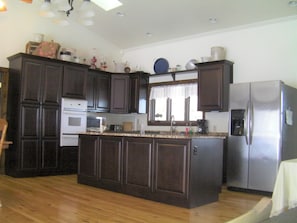 Main kitchen - with custom cabinets and granite countertops