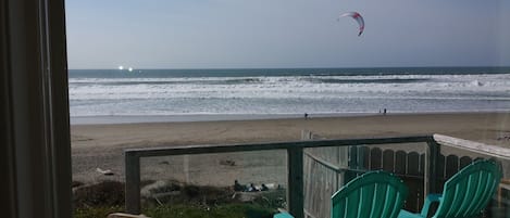 View from inside SurfSounds.  Deck with windscreen panels in foreground.