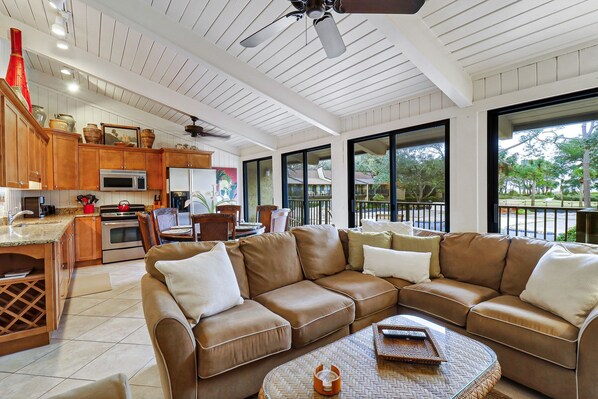 Living area setup with view to the deck/pool - Living room-couch setup with view to the deck/pool