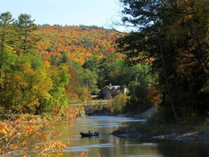 Canoe on the Schroon River which runs in front of the house.