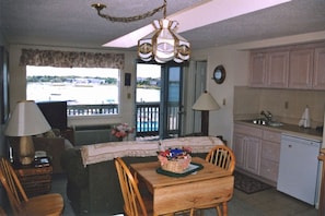 LR, kitchenette overlooking Bass River (table replaced with 4-seat dining table)