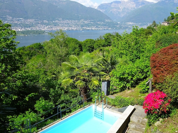 Water, Plant, Sky, Property, Mountain, Flower, Green, Building, Blue, Azure