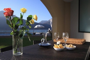 Private terrace with view towards pool and lake