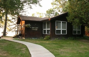 Wooden walkway leading to the cottage.