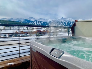Beautiful, modern hot tub to soak the bones after a day on the slopes...overlooking the peaks.