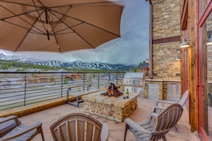 Massive west-facing home-wide patio that is the jewel of the home. Sit around an iron-log gas fireplace with a glass of wine. Grill some steaks while gazing at the mountains on the gourmet grill, or relax in the large modern hot tub.