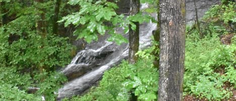 Waterfall just a few feet from back of cabin 