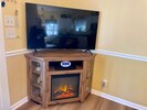 Family room with new TV and fireplace