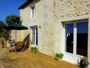 The rear of the barn showing double doors from kitchen and lounge.