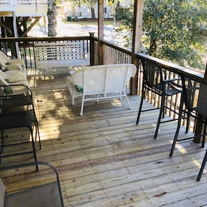 Spacious Covered porch with lots of seating, including a swing
