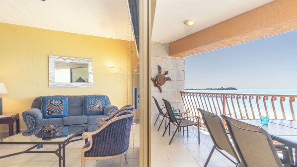 The living room flows onto the balcony.
