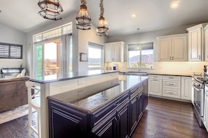 Chefs kitchen with huge island open to all the fun! Bar seating for 4