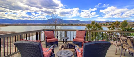 Deck overlooking Woodmoor Lake with gas fire pit.