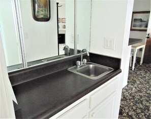 Separate counter and storage in hall. A buffer between living and sleeping areas