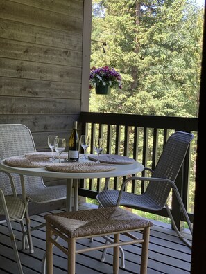 Summer view of Burgess Creek from the 2 level townhome. Loungers and gas grill.