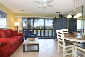 Living room leads out to screened in deck