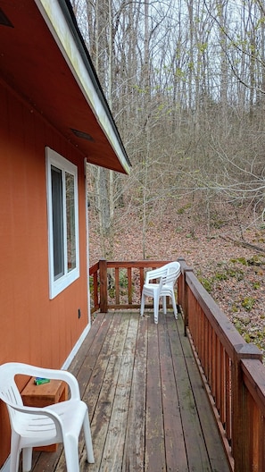 Deck shot going towards outside stairway with extra outside chairs