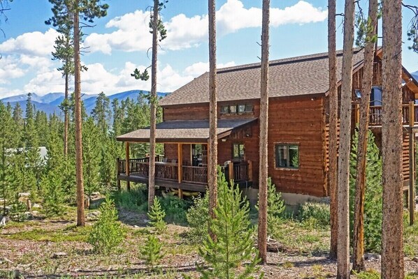 Side exterior and Rocky Mountain National Park peaks