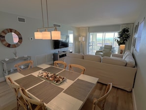 Living, dining room and large sliding doors to beachfront!